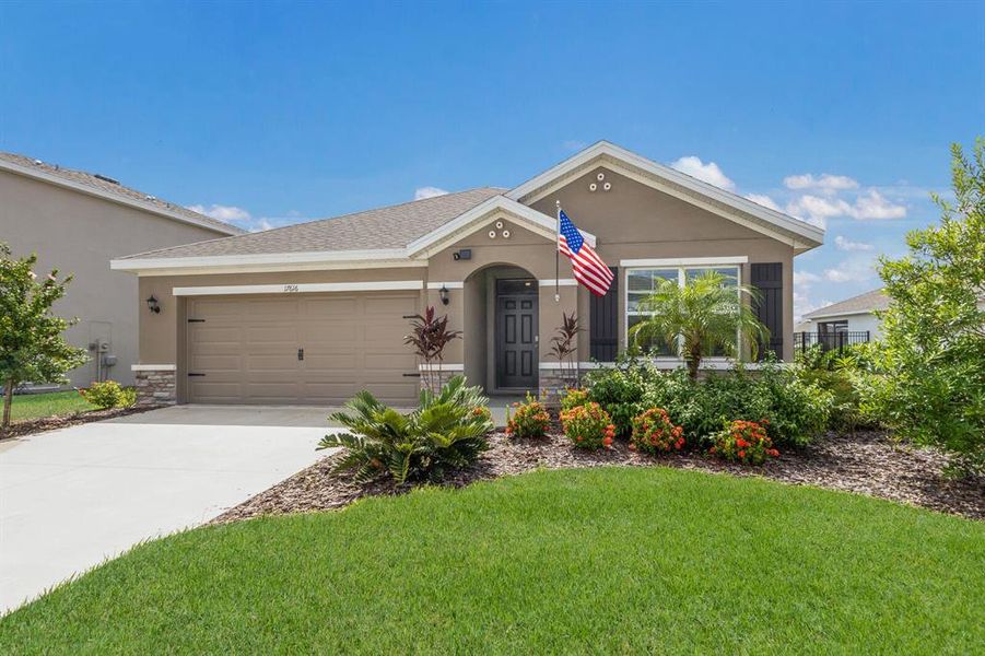 Front exterior of a new home in Solera at Lakewood Ranch, Bradenton, FL, highlighting curb appeal (Image 19).