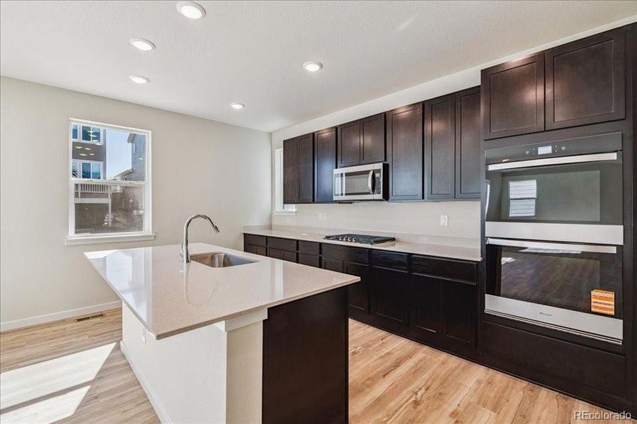 Furnished interior view inside a new home in Floret Collection at Alder Creek, Parker (Image 9).
