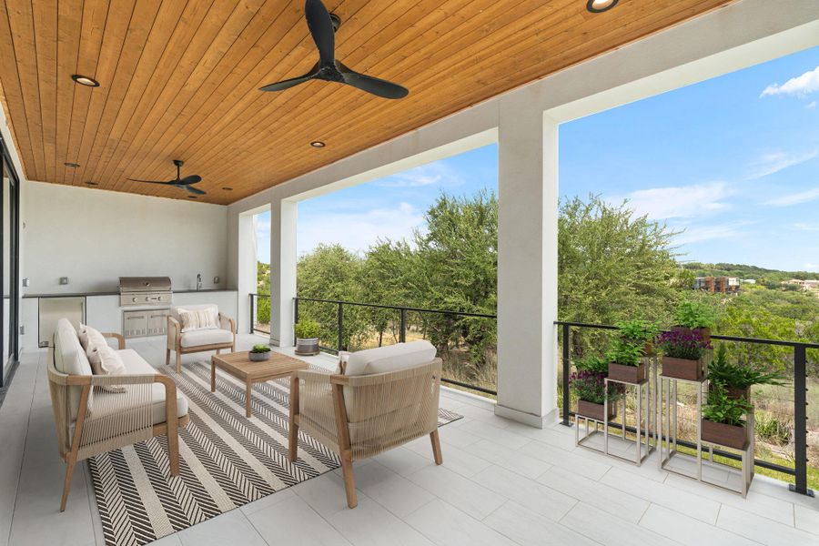Virtually staged outdoor living space features an integrated barbecue and serene treetop views.