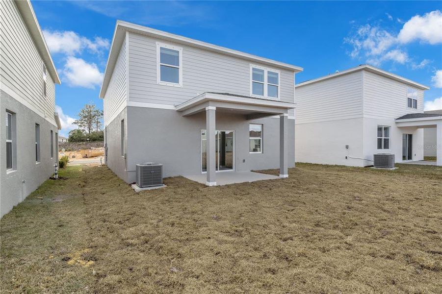Exterior details and patio area of a home in Oakfield Trails, Parrish (Image 23).