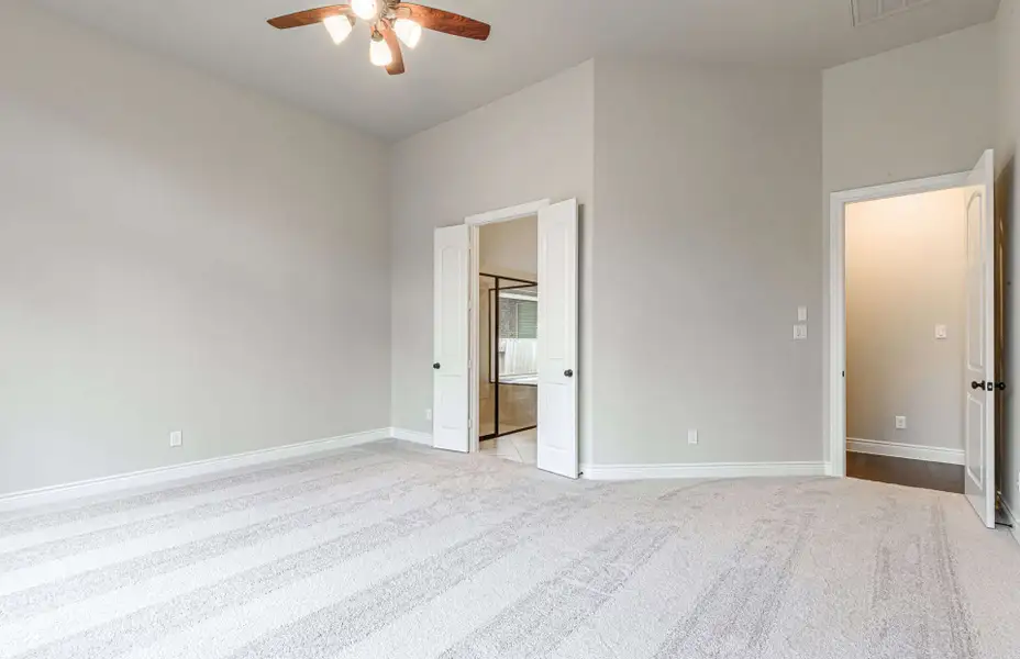 Representative unfurnished interior of a home built from the 3616 by Ravenna Homes in Artavia 70′, Conroe (Image 40).