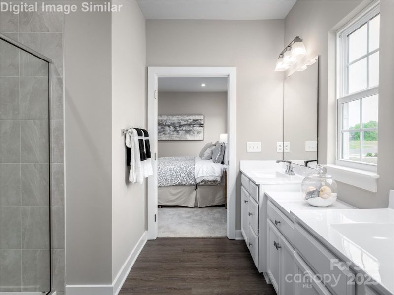 Anchored by a spacious primary bedroom and a large walk-in closet, this bathroom offers comfort, style, and plenty of room to unwind. Anchored by a spacious primary bedroom and a large walk-in closet, this bathroom offers comfort, style, and plenty of room to unwind.