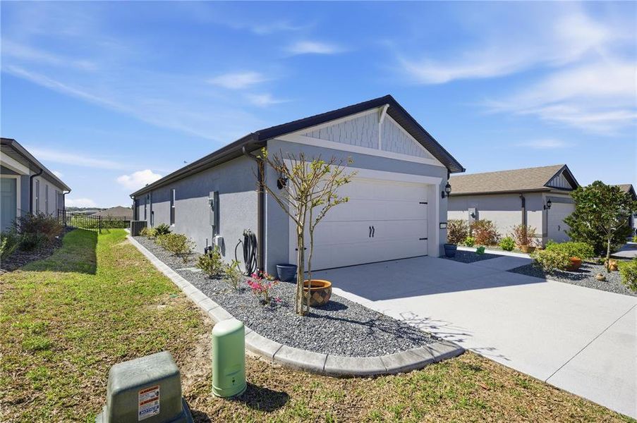 Front exterior of a new home in Del Webb Stone Creek, Ocala, FL, highlighting curb appeal (Image 20).