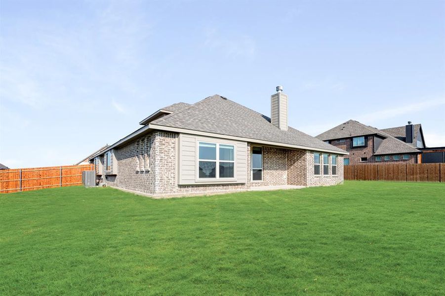 Front exterior of a new home in Coyote Crossing, Godley, TX, highlighting curb appeal (Image 2). Front exterior of a new home in Coyote Crossing, Godley, TX, highlighting curb appeal (Image 2).