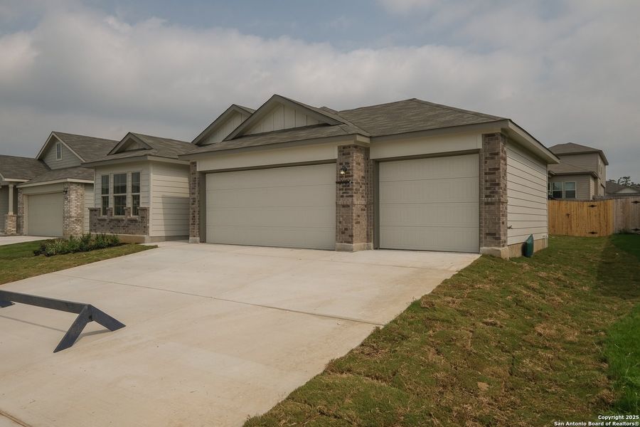 Front exterior of a new home in Greenspoint Heights, Seguin, TX, highlighting curb appeal (Image 23).