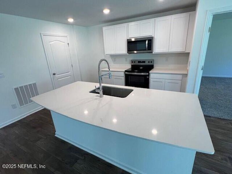 Furnished interior view inside a new home in Sawmill Branch Express, Palm Coast (Image 7). Furnished interior view inside a new home in Sawmill Branch Express, Palm Coast (Image 7).