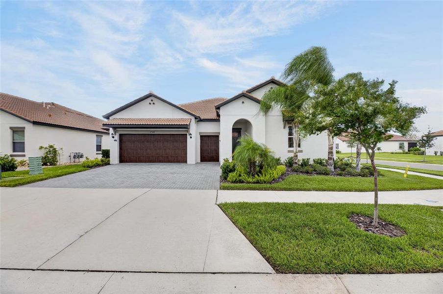 Front exterior of a new home in Southshore Bay Active Adult, Wimauma, FL, highlighting curb appeal (Image 31).