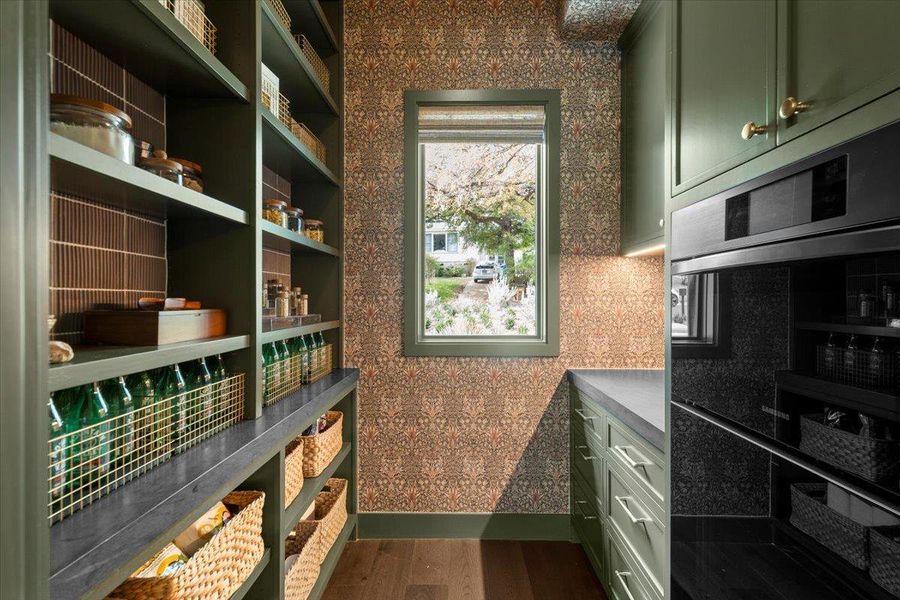 The fantastic pantry boasts a Bespoke microwave combination wall oven and an additional sink, perfect for additional prep space when entertaining.