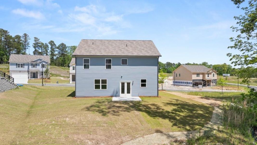 Exterior details and patio area of a home in Northwoods at Mirror Lake, Villa Rica (Image 4).