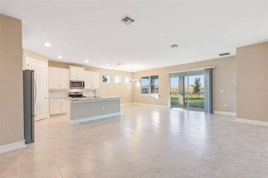 Spacious, unfurnished interior of a new home in Deep Creek Tradition Series, Punta Gorda (Image 19).