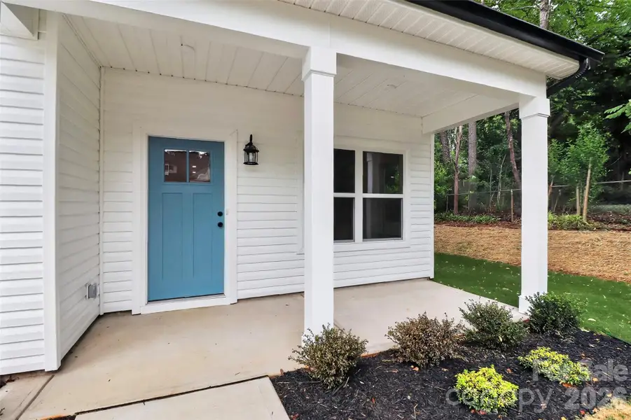 Exterior details and patio area of a home in , Belmont (Image 3).