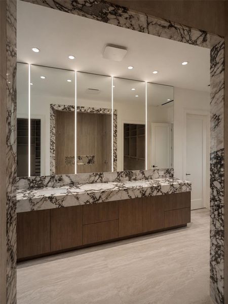 Primary bathroom details provide coordinated elegance, including in framing.