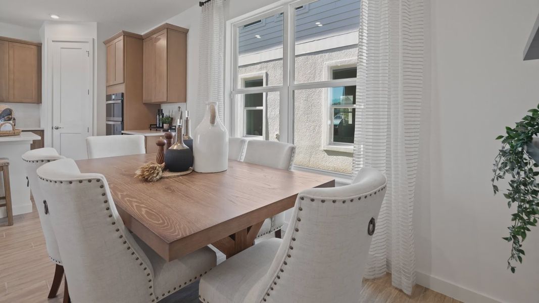 Cozy cafe with large double window in a DRB Home Clementine model at the Trinity Place community.