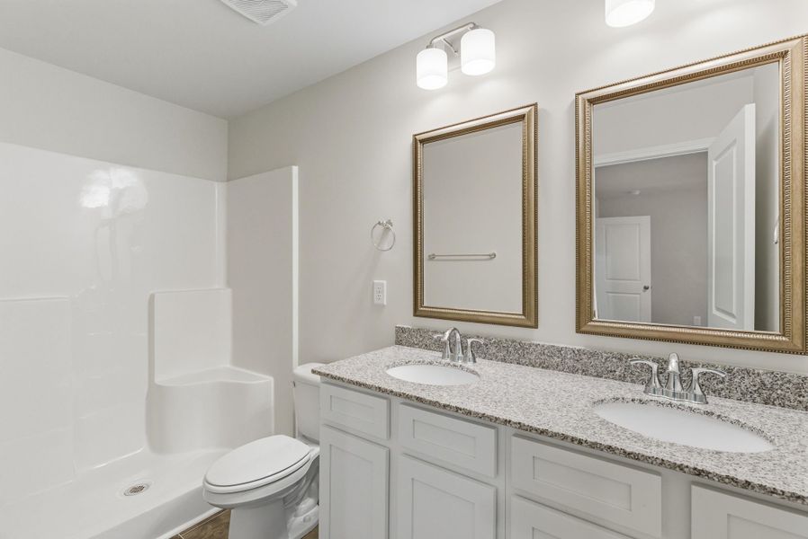 Representative furnished interior of a home built from the Palmetto II by McGuinn Homes in Clarke Townes, Anderson (Image 12).