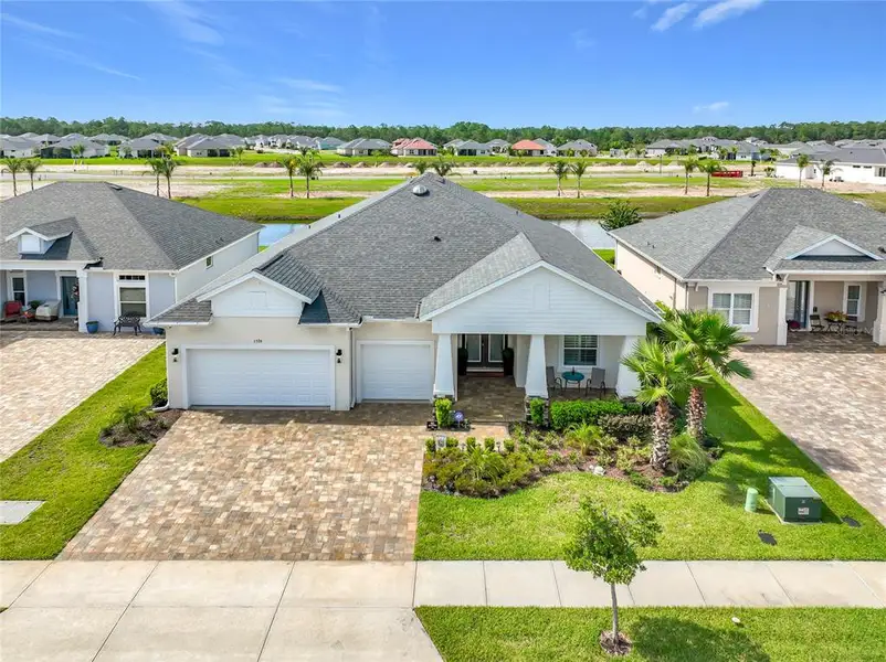 Front exterior of a new home in The Reserve at Victoria, Deland, FL, highlighting curb appeal (Image 2). Front exterior of a new home in The Reserve at Victoria, Deland, FL, highlighting curb appeal (Image 2).