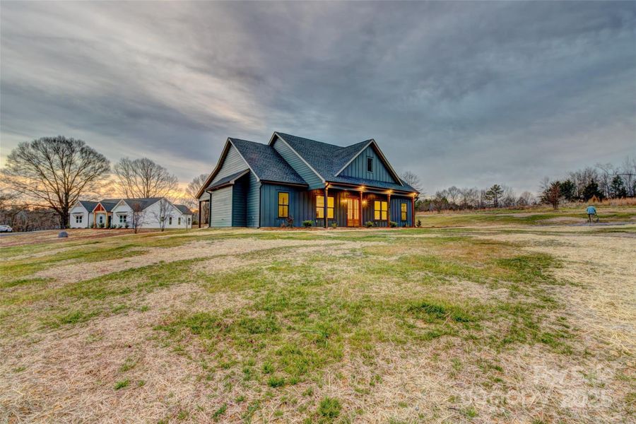 Front exterior of a new home in , Bessemer City, NC, highlighting curb appeal (Image 1). Front exterior of a new home in , Bessemer City, NC, highlighting curb appeal (Image 1).