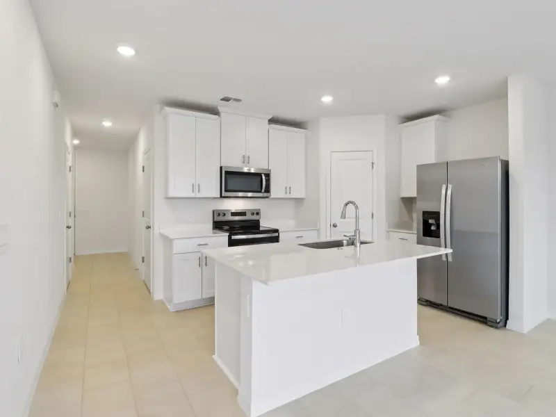 Furnished interior view inside a new home in The Reserve at Hammock Oaks Townes, Lady Lake (Image 6).