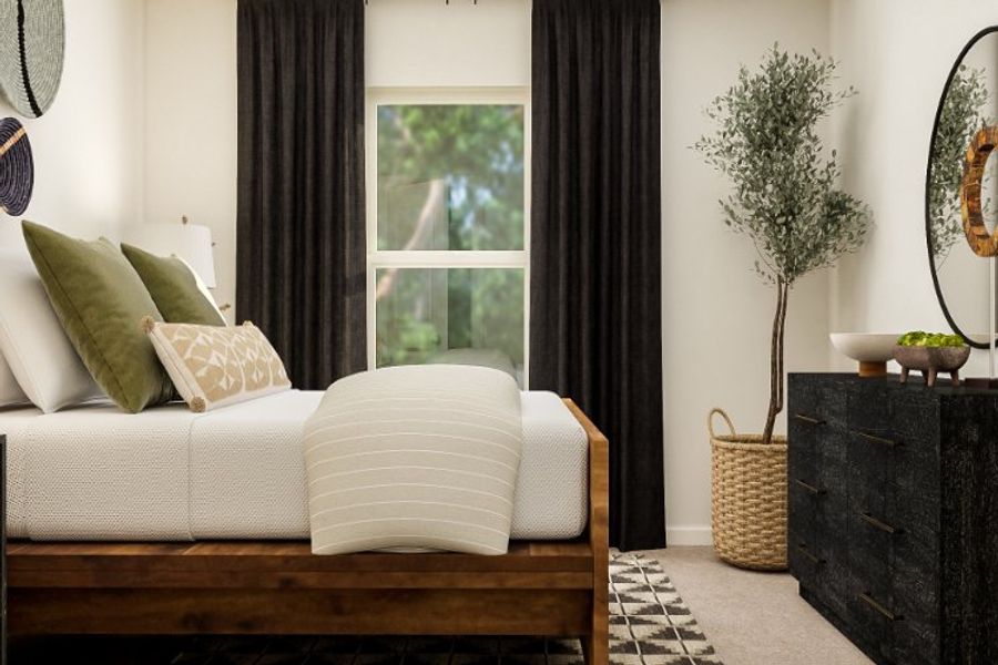 A white couch with pillows.