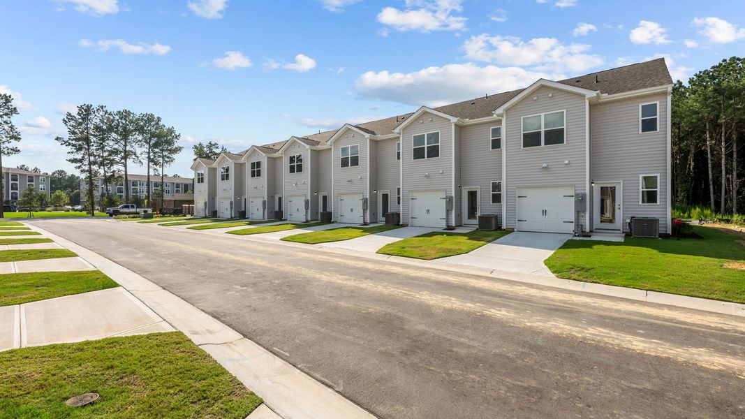 Front exterior of a new home in Clock Road Townhomes, New Bern, NC, highlighting curb appeal (Image 22).