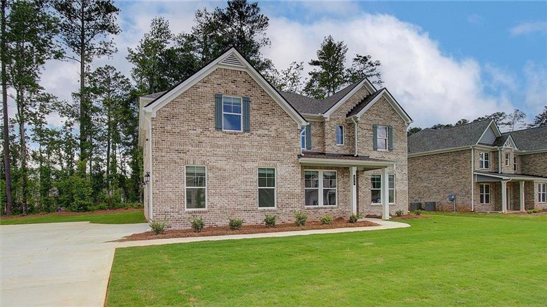 Front exterior of a new home in Trinity Park, McDonough, GA, highlighting curb appeal (Image 21).