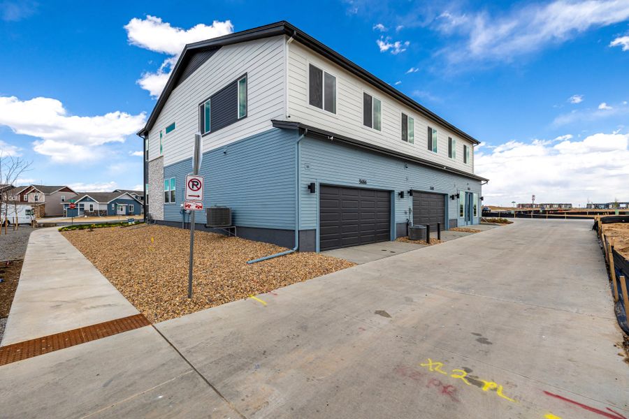 Front exterior of a new home in Painted Prairie, Aurora, CO, highlighting curb appeal (Image 26).