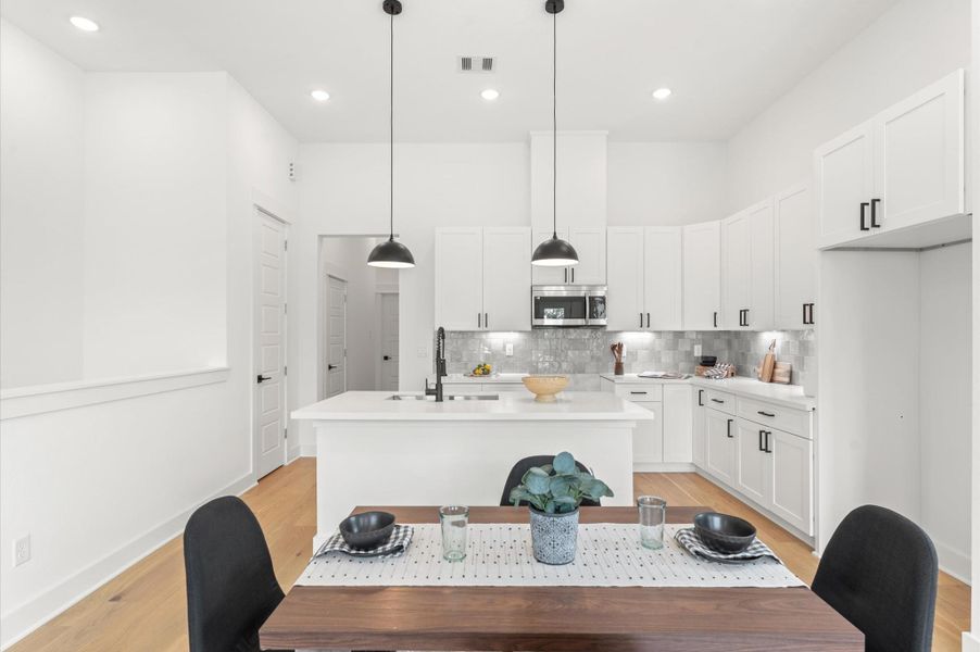 Adjacent dining area easily accommodates a full-size table, while the living space is inviting with cozy seating and access to a private balcony Adjacent dining area easily accommodates a full-size table, while the living space is inviting with cozy seating and access to a private balcony