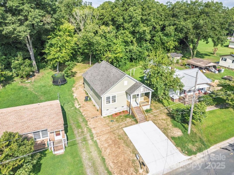 Front exterior of a new home in , Statesville, NC, highlighting curb appeal (Image 26).