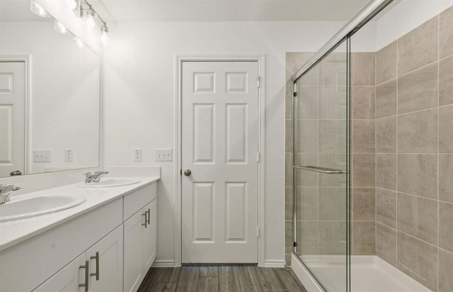 Owner's bath with oversized shower *Real home pictured