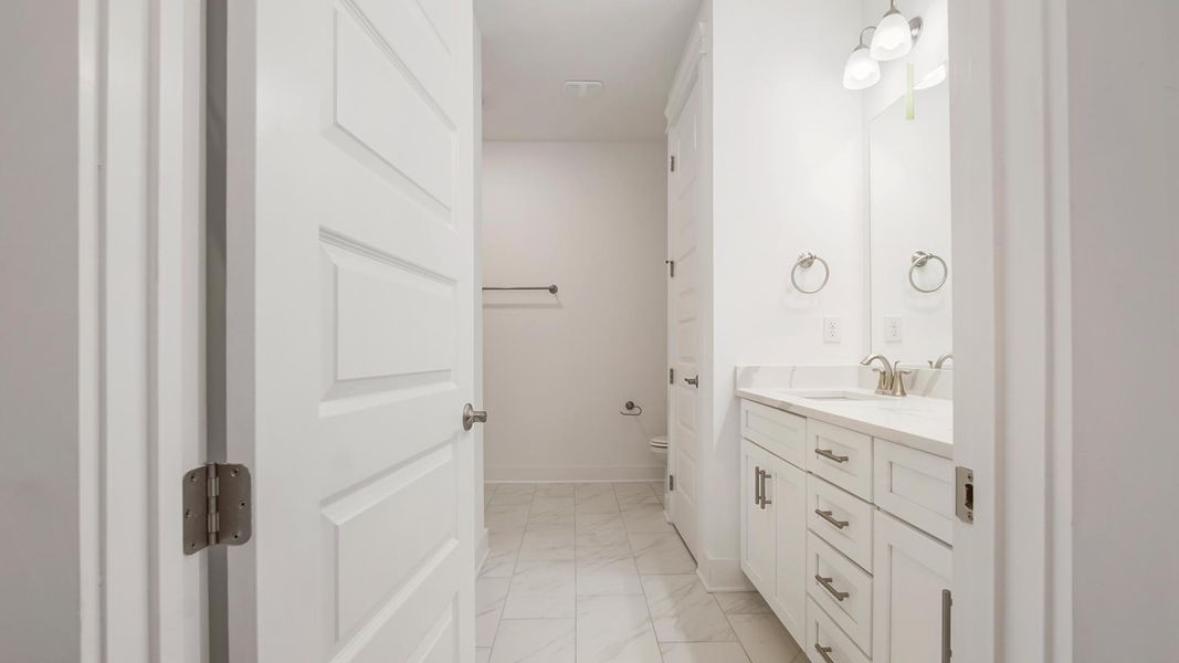 Representative furnished interior of a home built from the Camellia by D.R. Horton in Breakfast Point East Phase II, Panama City Beach (Image 13).