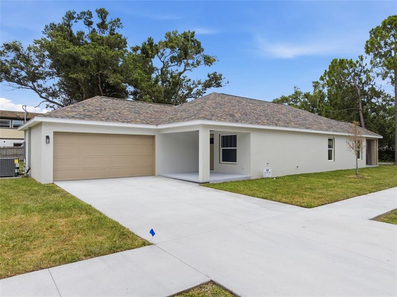 Front exterior of a new home in , St. Petersburg, FL, highlighting curb appeal (Image 1). Front exterior of a new home in , St. Petersburg, FL, highlighting curb appeal (Image 1).