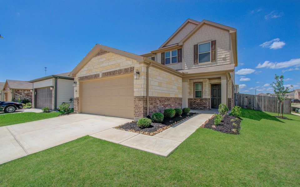 Front exterior of a new home in , Hockley, TX, highlighting curb appeal (Image 20).