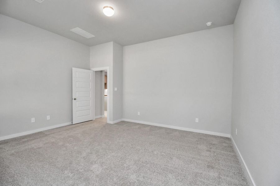 Come and unwind after a long day in this magnificent primary suite! This spacious room features plush carpet, warm paint, high ceilings and large windows with privacy blinds. Sample photo of completed home with similar floor plan. Actual colors and selections may vary. Come and unwind after a long day in this magnificent primary suite! This spacious room features plush carpet, warm paint, high ceilings and large windows with privacy blinds. Sample photo of completed home with similar floor plan. Actual colors and selections may vary.