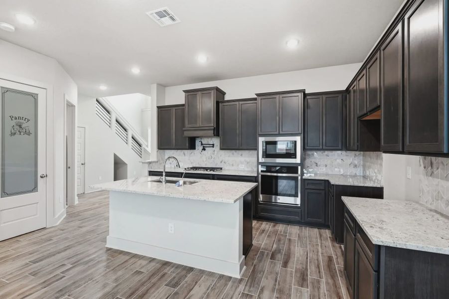 Representative furnished interior of a home built from the Jordy by Chesmar Homes in Stillwater Ranch, Buda (Image 3).