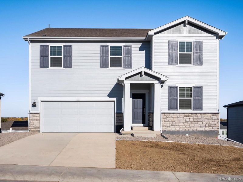 Front exterior of a new home in , Windsor, CO, highlighting curb appeal (Image 1).