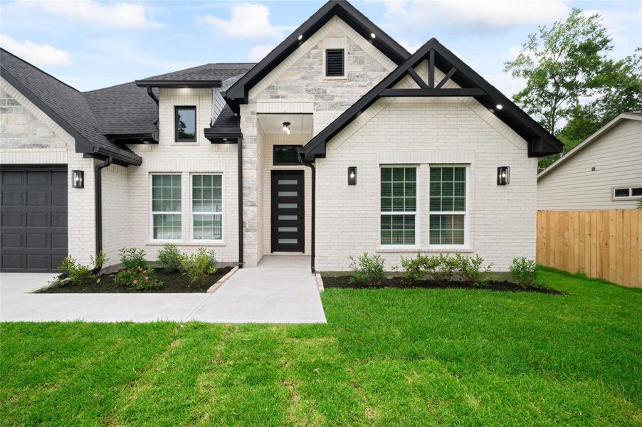 Front exterior of a new home in , Porter, TX, highlighting curb appeal (Image 25).