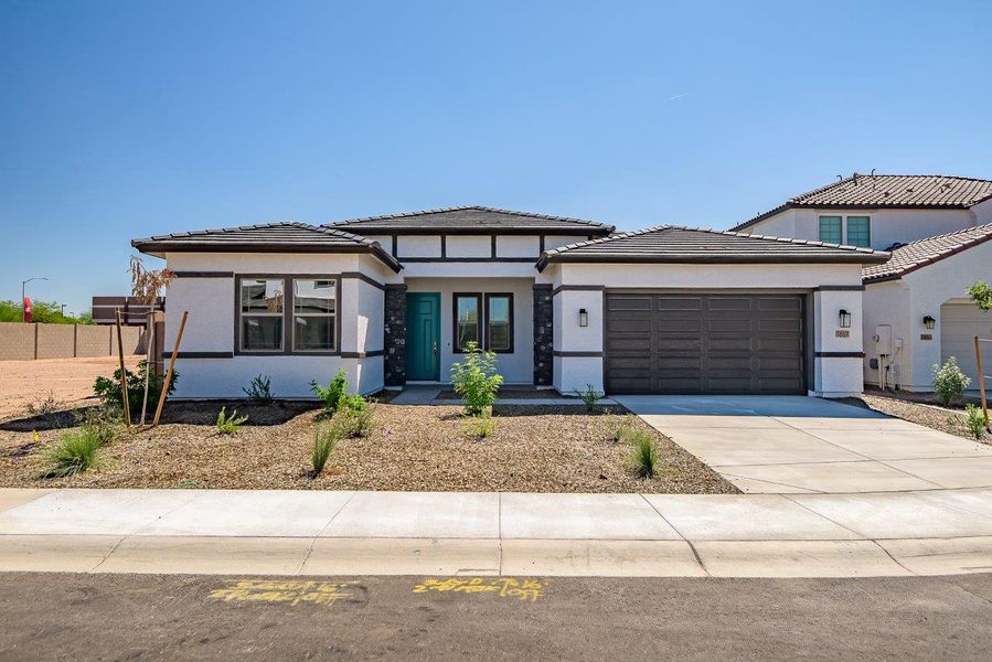 Front exterior of a new home in Legends at Thunderbird, Glendale, AZ, highlighting curb appeal (Image 28). Front exterior of a new home in Legends at Thunderbird, Glendale, AZ, highlighting curb appeal (Image 28).