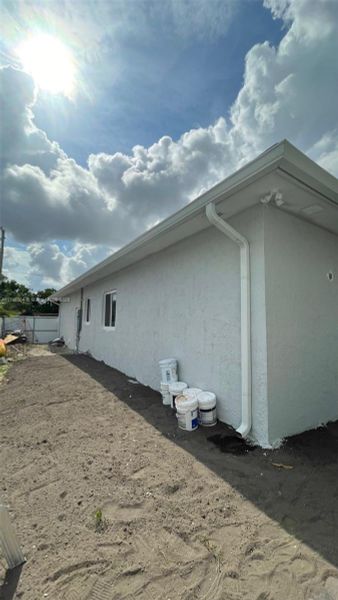 Front exterior of a new home in , Homestead, FL, highlighting curb appeal (Image 1).