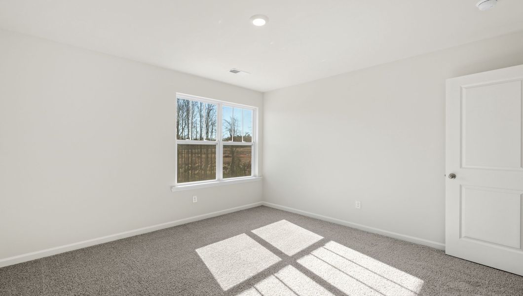 Representative unfurnished interior of a home built from the WILMINGTON by D.R. Horton in Benjamin's Grove, Woodruff (Image 25).
