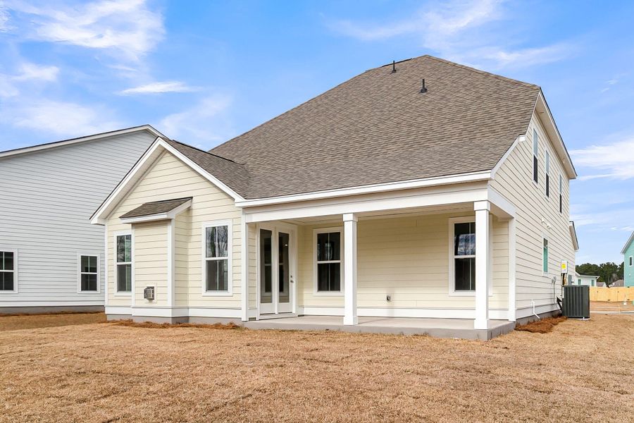 Exterior details and patio area of a home in Tidewater at Lakes of Cane Bay, Summerville (Image 22).