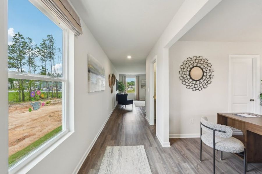 A room with a table and chairs.