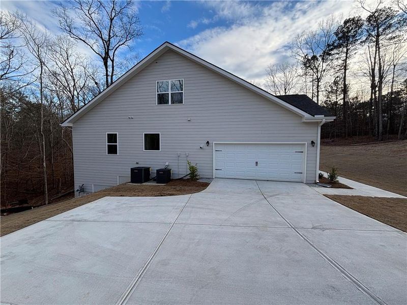 Front exterior of a new home in Tuscany Hills, Douglasville, GA, highlighting curb appeal (Image 1). Front exterior of a new home in Tuscany Hills, Douglasville, GA, highlighting curb appeal (Image 1).