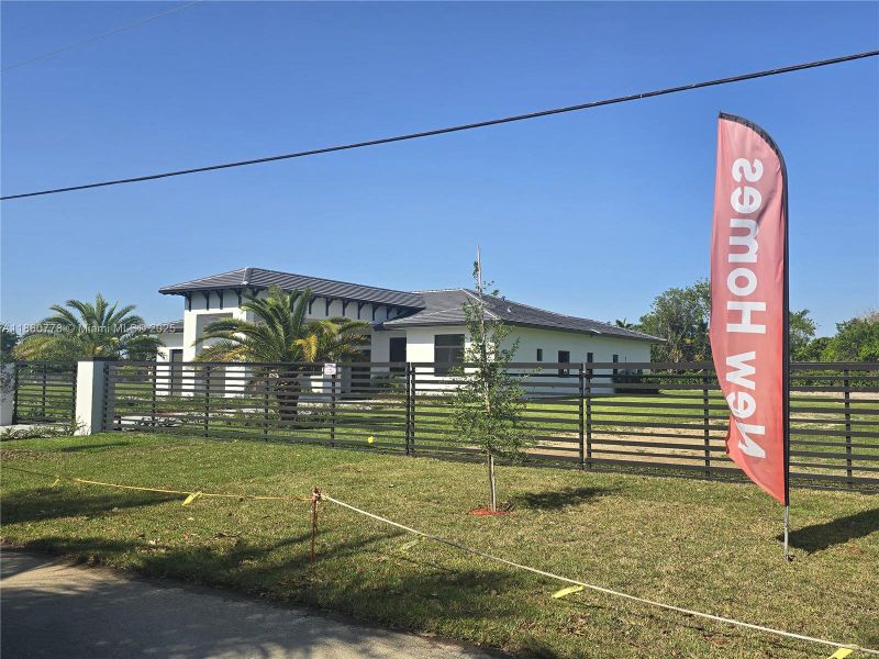 Front exterior of a new home in , Homestead, FL, highlighting curb appeal (Image 39).