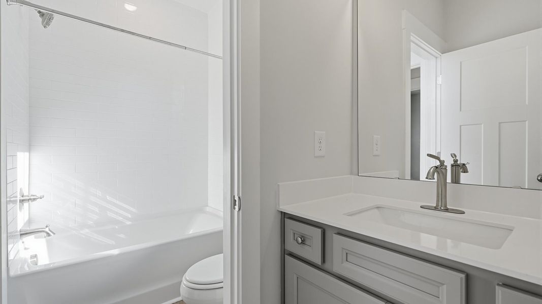 Well-appointed full bath with high standards of craftsmanship and everyday function at the Wells Crossing community