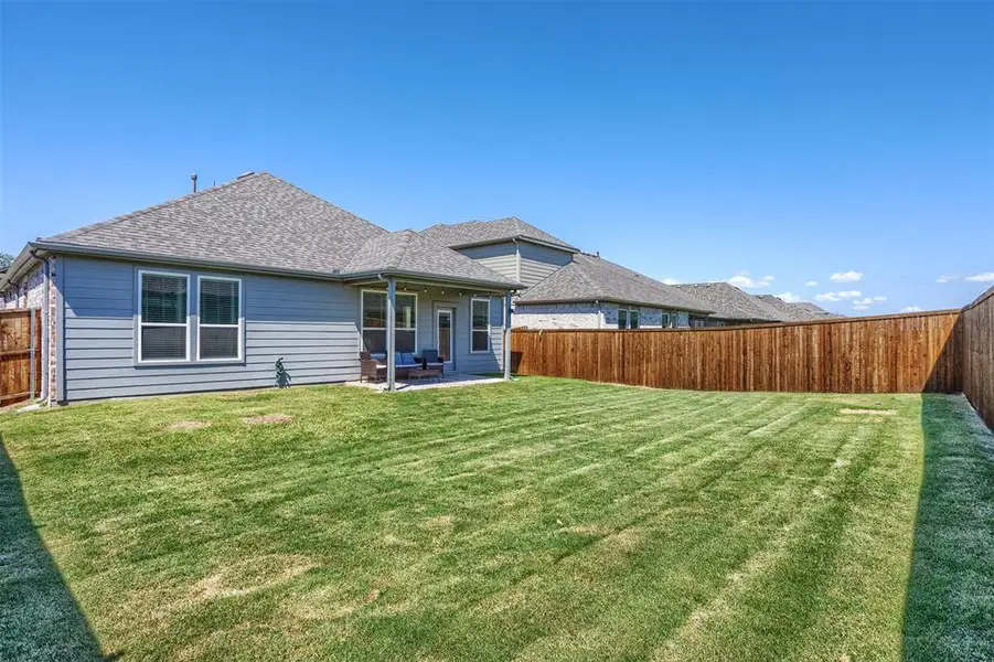 Front exterior of a new home in , Anna, TX, highlighting curb appeal (Image 1). Front exterior of a new home in , Anna, TX, highlighting curb appeal (Image 1).