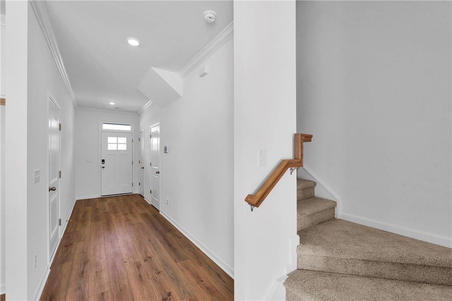 This entry hall features durable flooring and a ca This entry hall features durable flooring and a ca