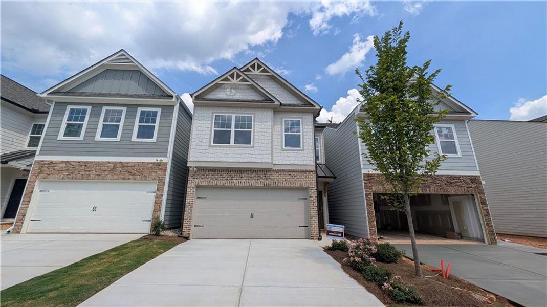 Front exterior of a new home in Owen Preserve, Canton, GA, highlighting curb appeal (Image 2). Front exterior of a new home in Owen Preserve, Canton, GA, highlighting curb appeal (Image 2).