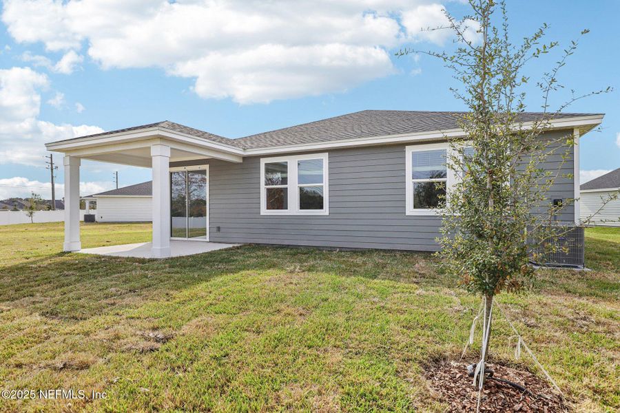 Exterior details and patio area of a home in Cypress Meadows - Signature Series, Jacksonville (Image 3).