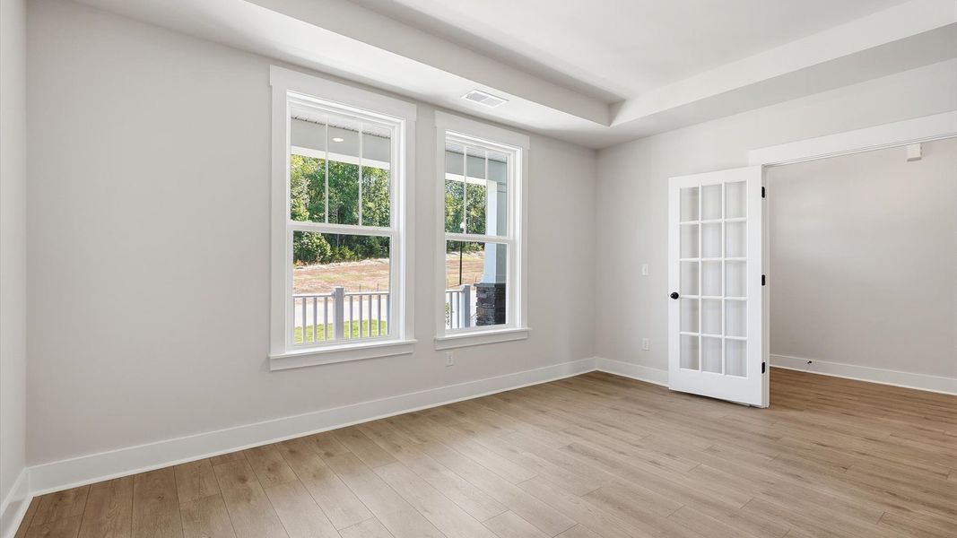 Tasteful French door study offering a quiet, elegant workspace in this vibrant Woodruff home