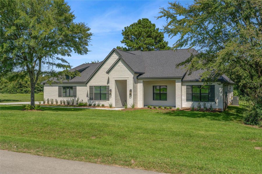 Front exterior of a new home in Chapel Bend, Montgomery, TX, highlighting curb appeal (Image 16). Front exterior of a new home in Chapel Bend, Montgomery, TX, highlighting curb appeal (Image 16).