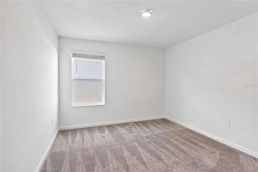 Spacious, unfurnished interior of a new home in Storey Creek: Manor Collection, Kissimmee (Image 18).